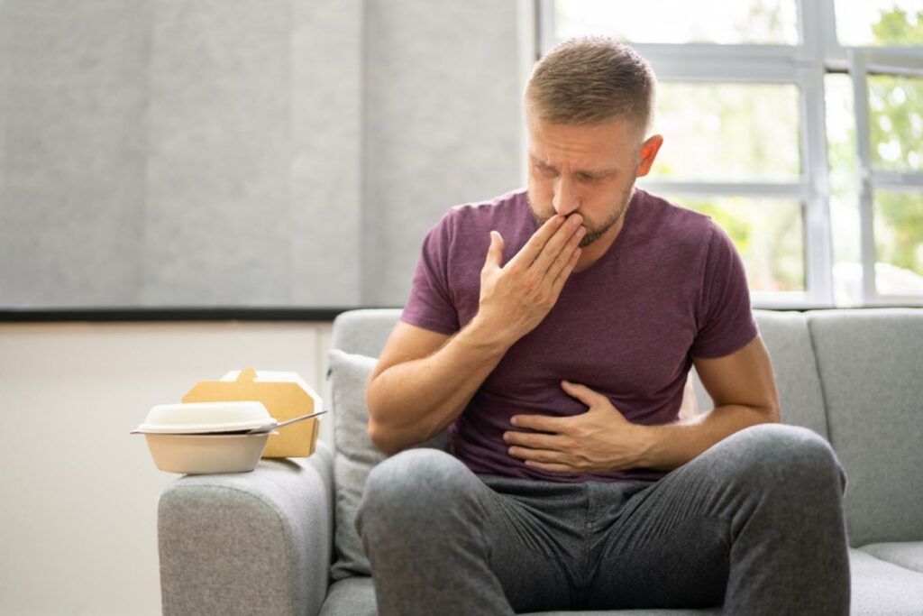https://www.shutterstock.com/image-photo/unhealthy-fastfood-stomach-heartburn-person-after-2039879552